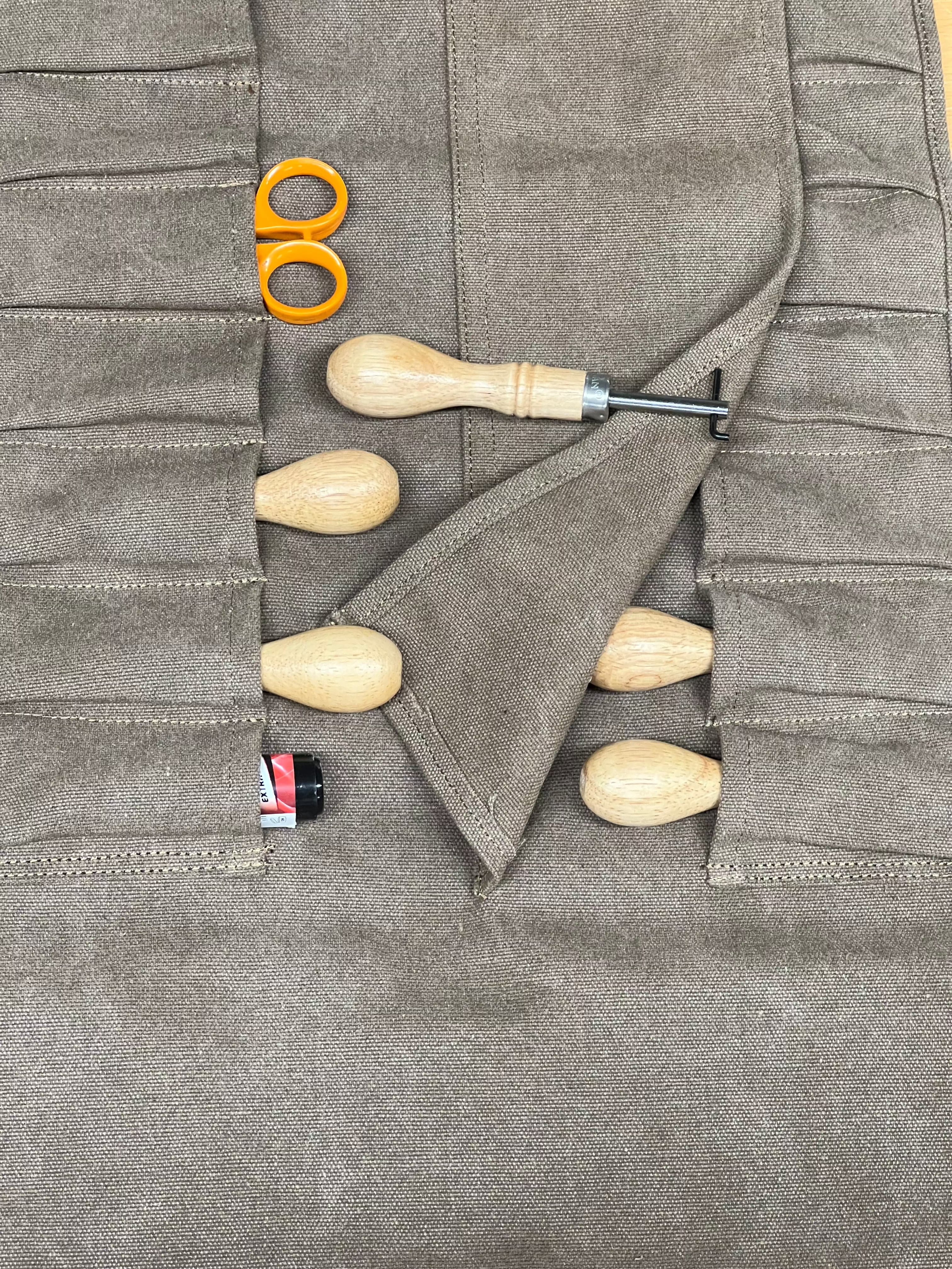 Rollable canvas tool bag.