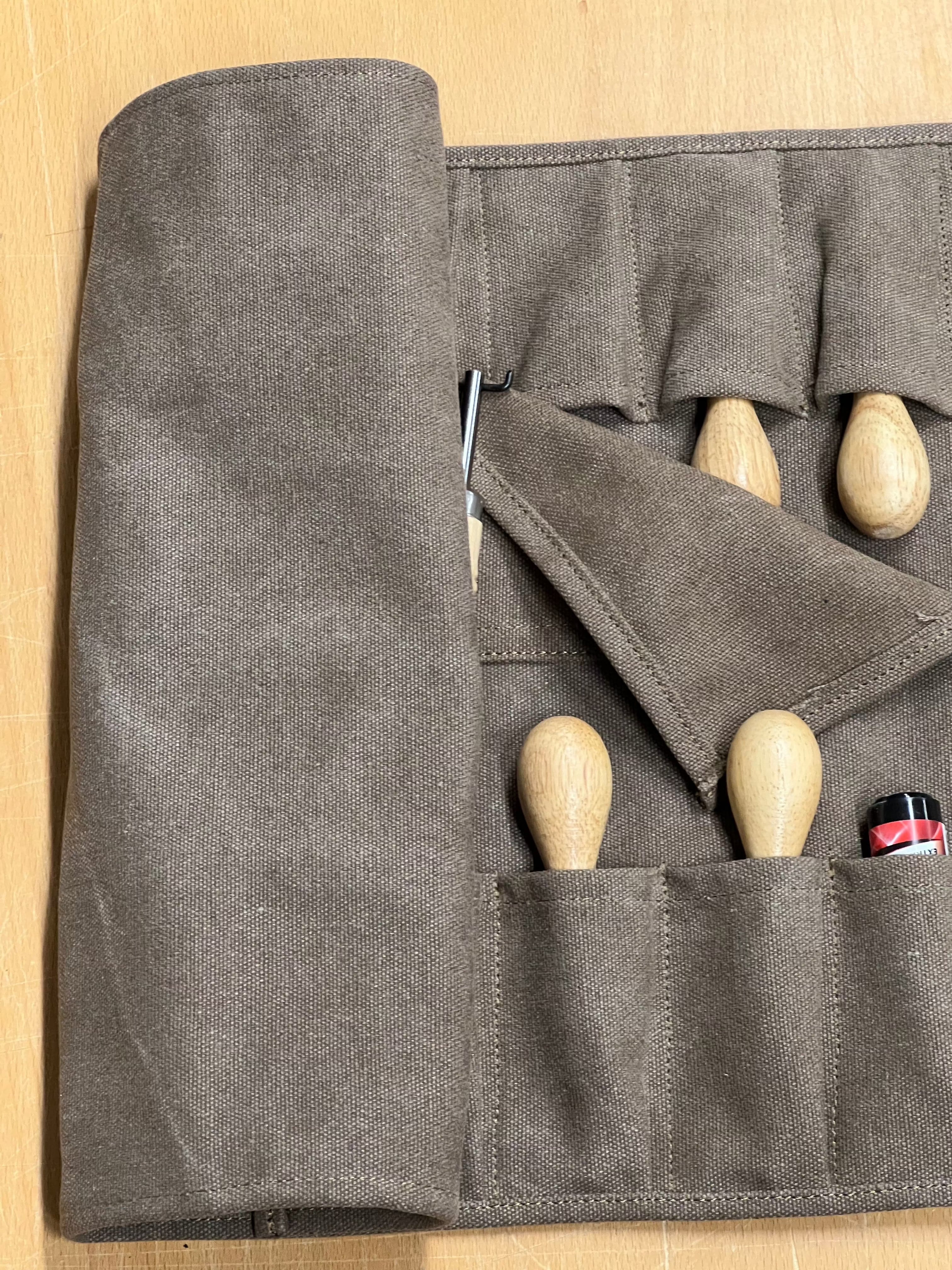 Rollable canvas tool bag.