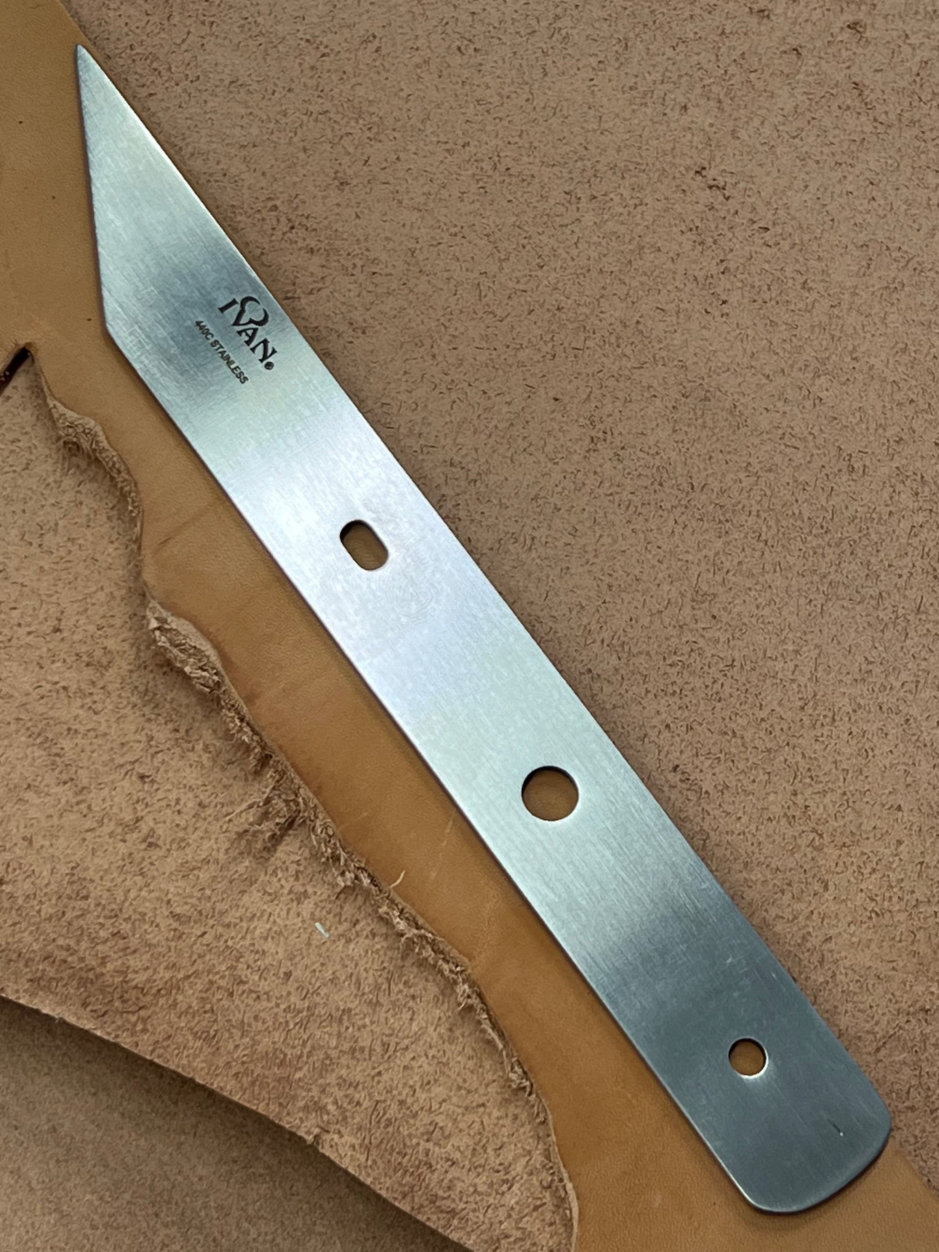 French-style angled leather knife blade