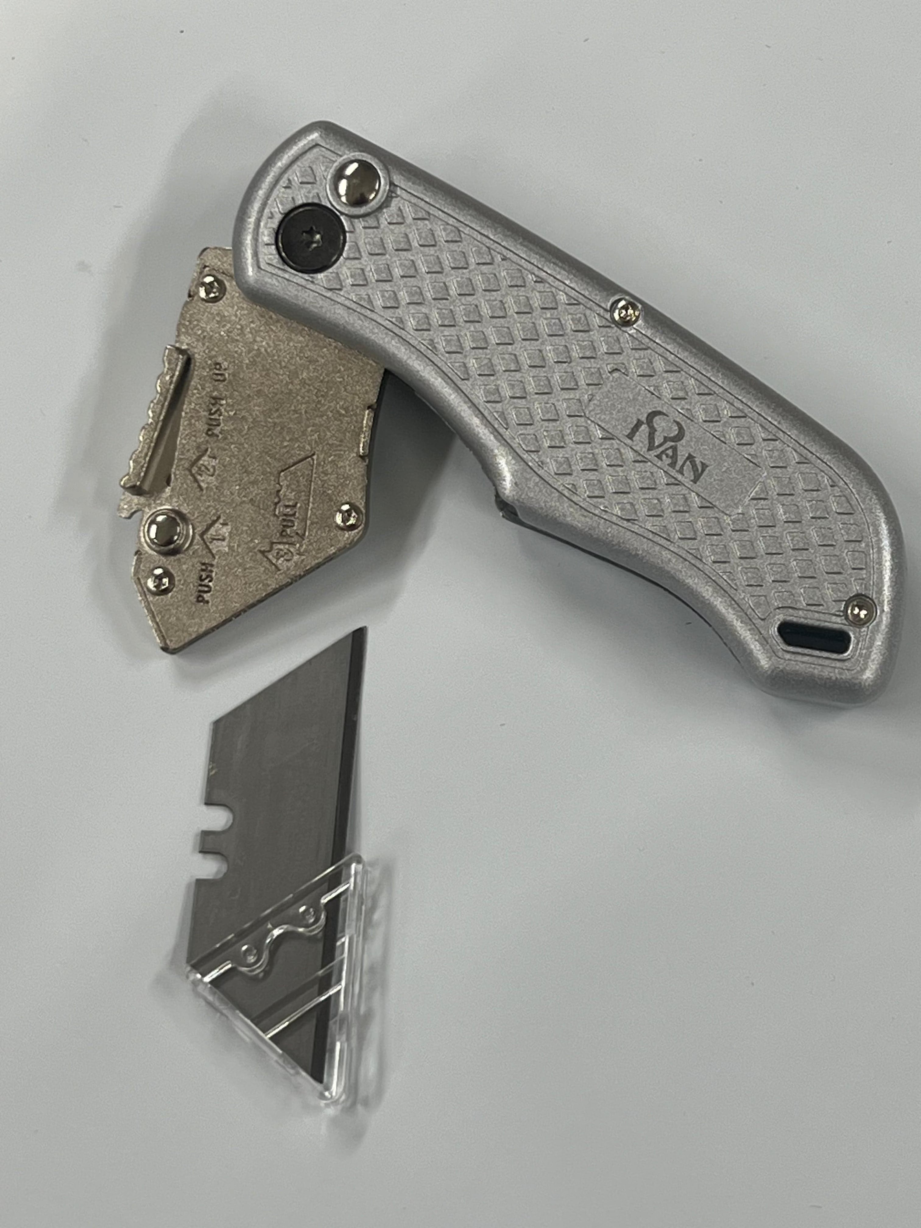Folding knife with replaceable blade and belt clip