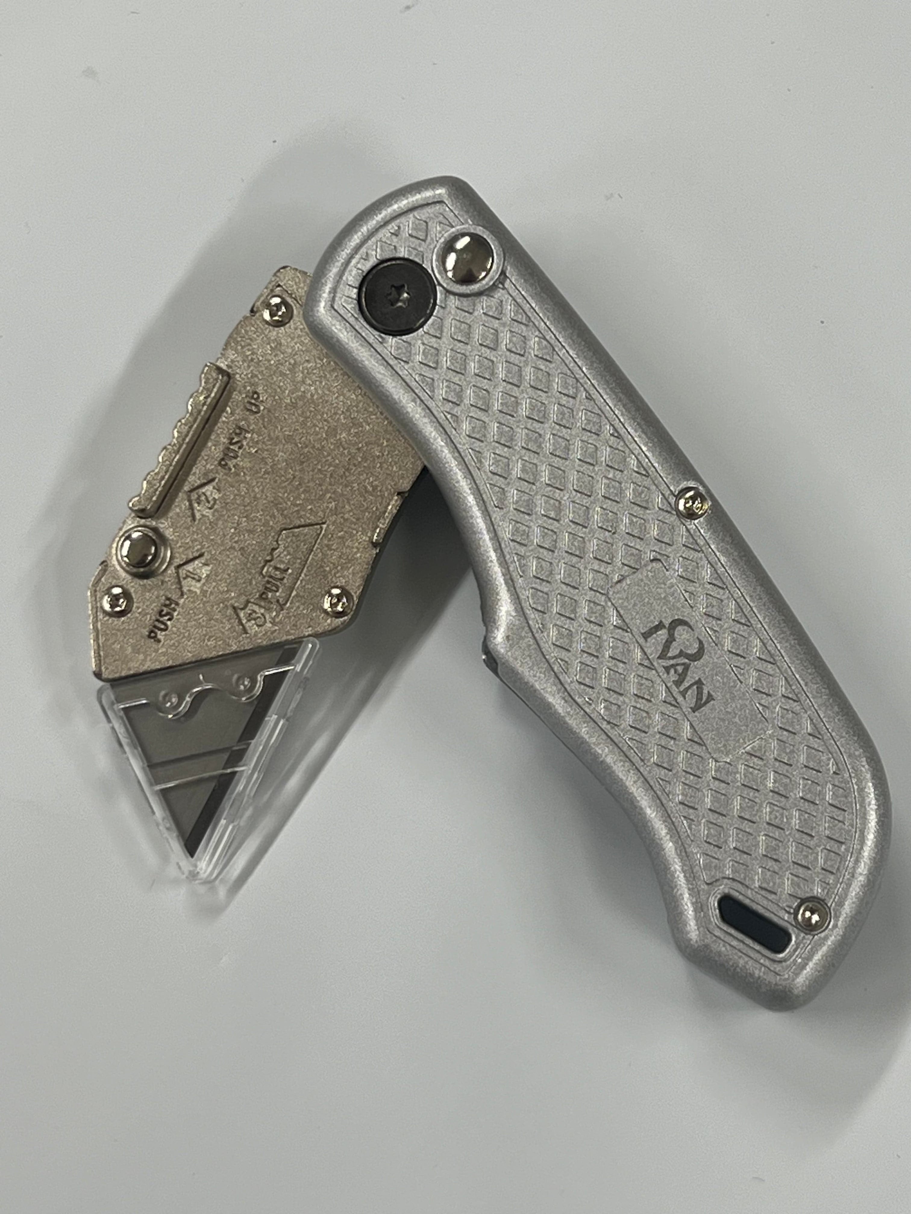 Folding knife with replaceable blade and belt clip
