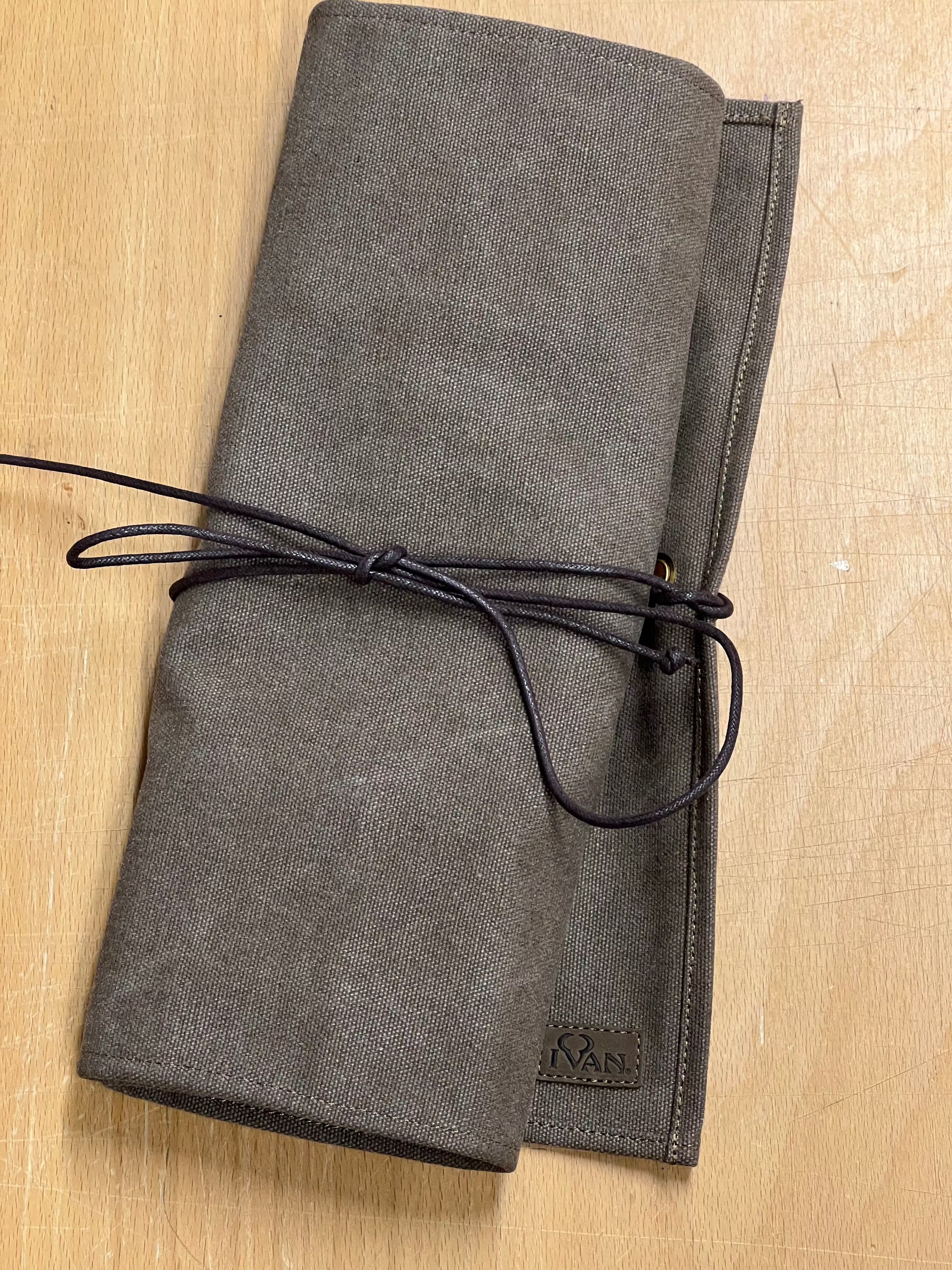 Rollable canvas tool bag.